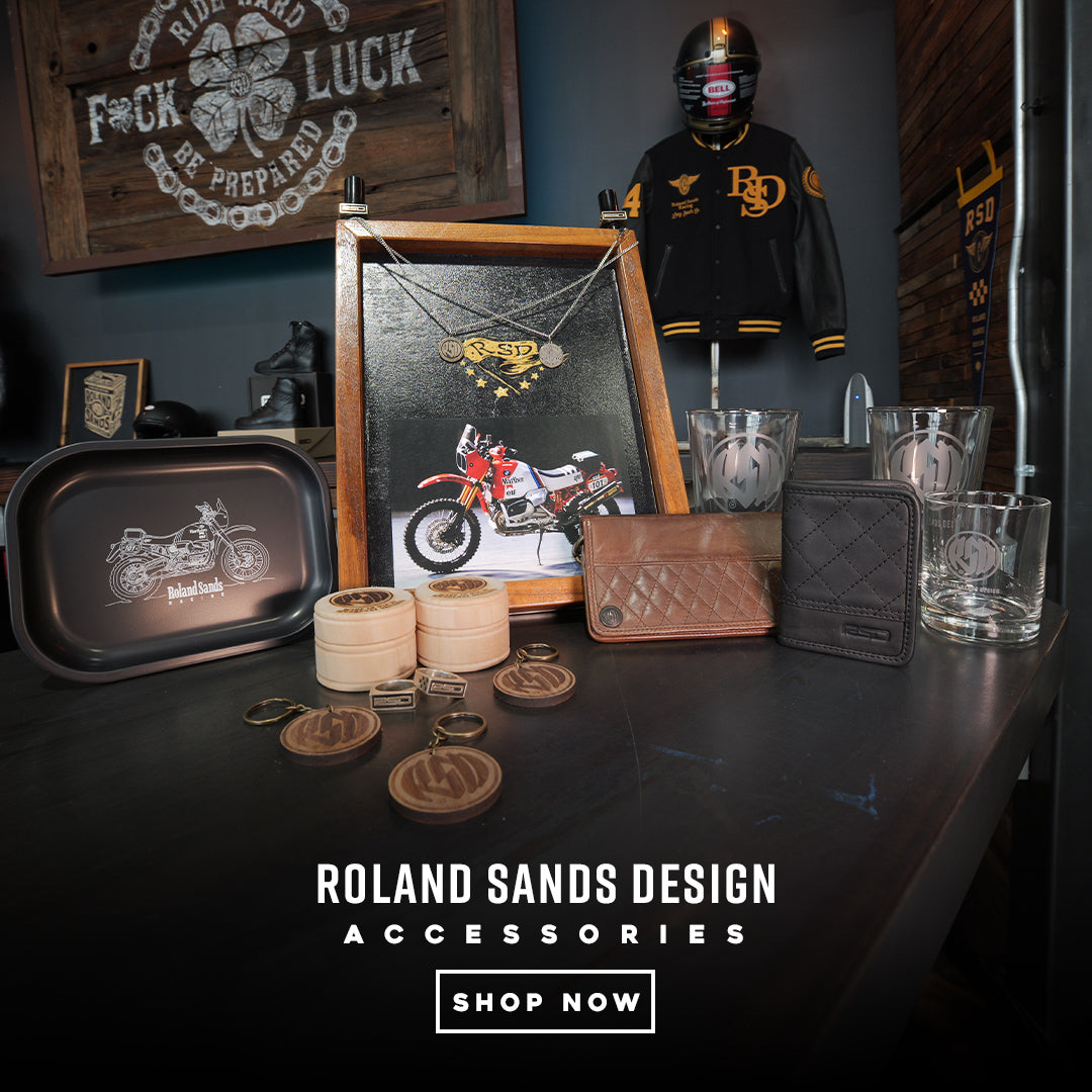 a rsd accessories banner showcasing two rsd wallets, keychains, necklaces, clear whisky glasses and ashtraty with logos