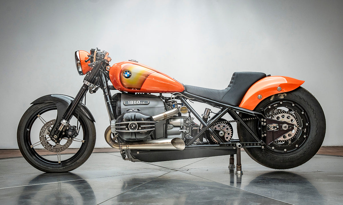 left side profile photo of the orange RSD x BMW R18 Dragster II motorcycle.