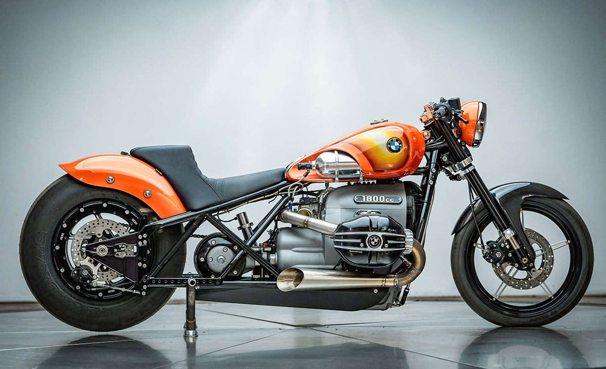 right side profile photo of the orange RSD x BMW R18 Dragster II motorcycle.