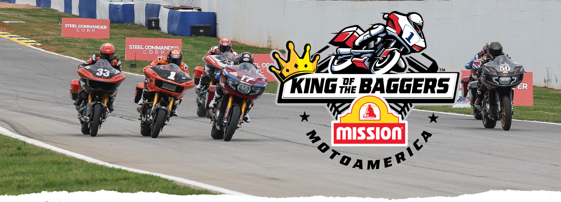 Dynamic start of a King of the Baggers race at Michelin Raceway Road Atlanta, with motorcycles charging down the track. Riders numbered 33, 1, and 17 lead a group, showcasing intense competition and speed. The image includes a vibrant promotional overlay featuring the 'King of the Baggers' and 'Mission MotoAmerica' logos, enhancing the racing theme.