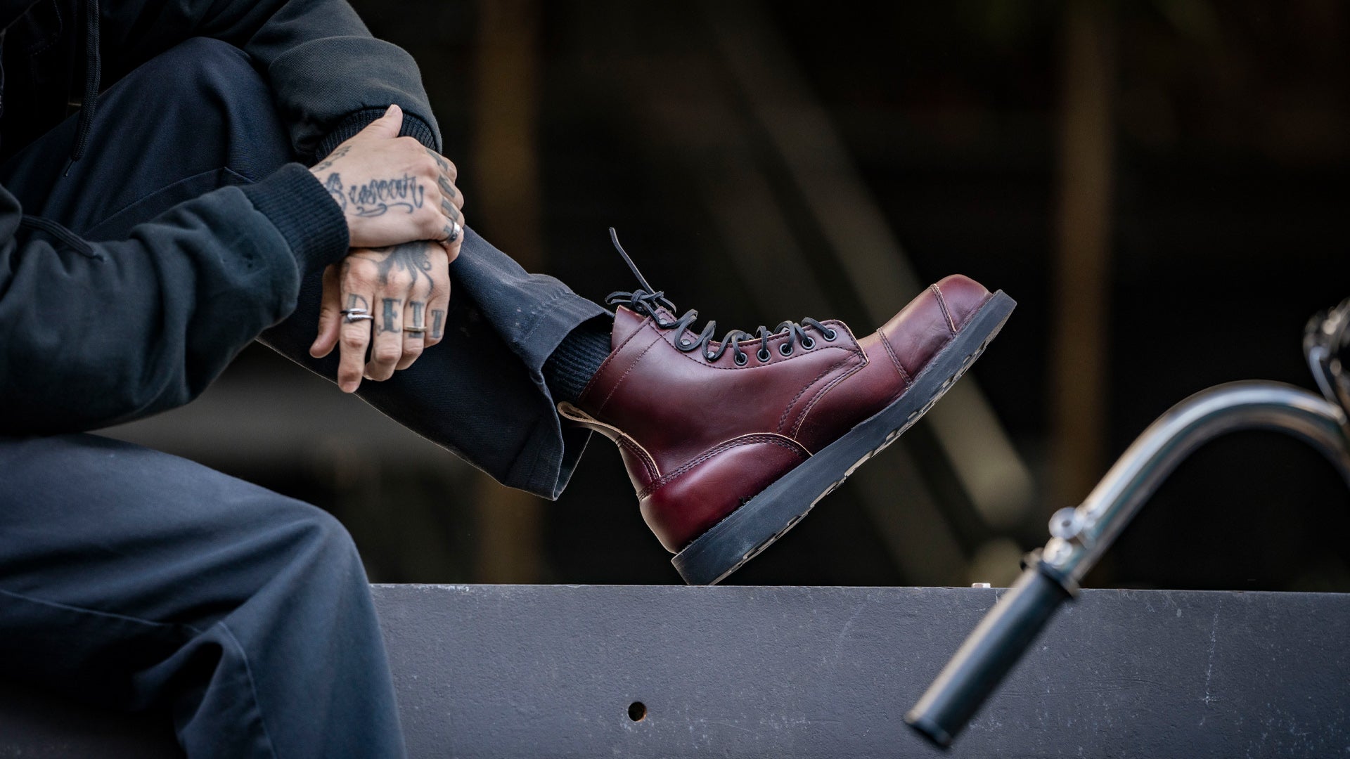 closeup shot of a guy with hand tattoos wearing mojave RSD x White's boots